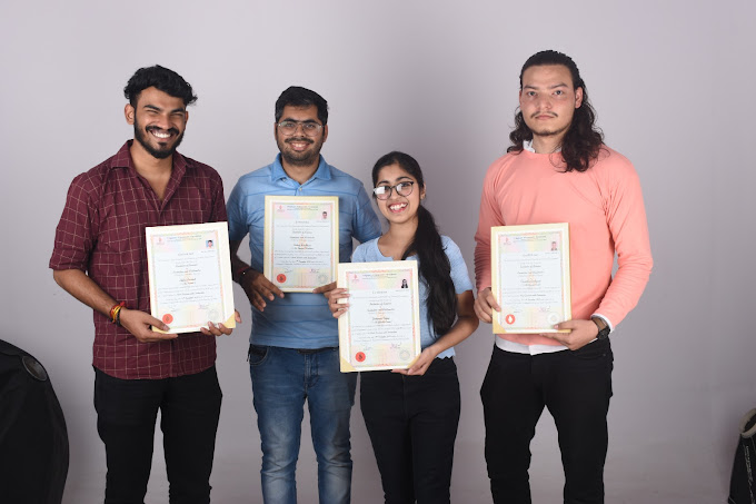 TGC students holding their certificates